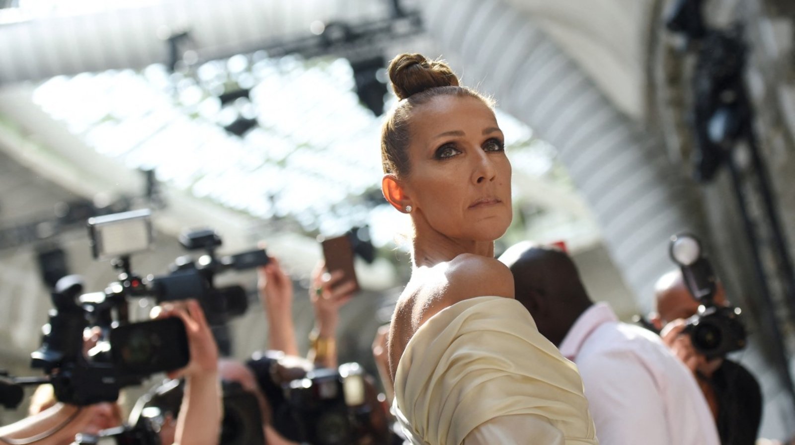 (FILES) Canadian singer Celine Dion poses as she arrives for the Alexandre Vauthier Women's Fall-Winter 2019/2020 Haute Couture collection fashion show in Paris, on July 2, 2019. Quebec star Celine Dion officially announced on March 30, 2026, a series of ten concerts in Paris in September and October in Europe's largest indoor venue, near Paris, to mark her 58th birthday, confirming her return to the stage after six years away from the public. (Photo by Lucas BARIOULET / AFP)